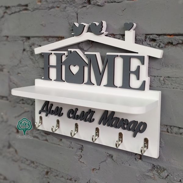 Wall-mounted key holder HOME with family name on order