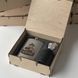 Set of flask with glasses in a wooden box with a logo