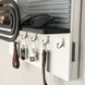 Designer wall key holder on a wooden shield