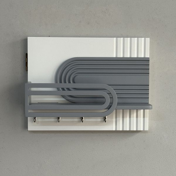 Designer key holder on the shield in white and gray