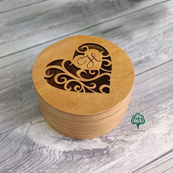 Wooden wedding ring box with openwork