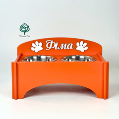 Bowls on a wooden stand with the dog's name