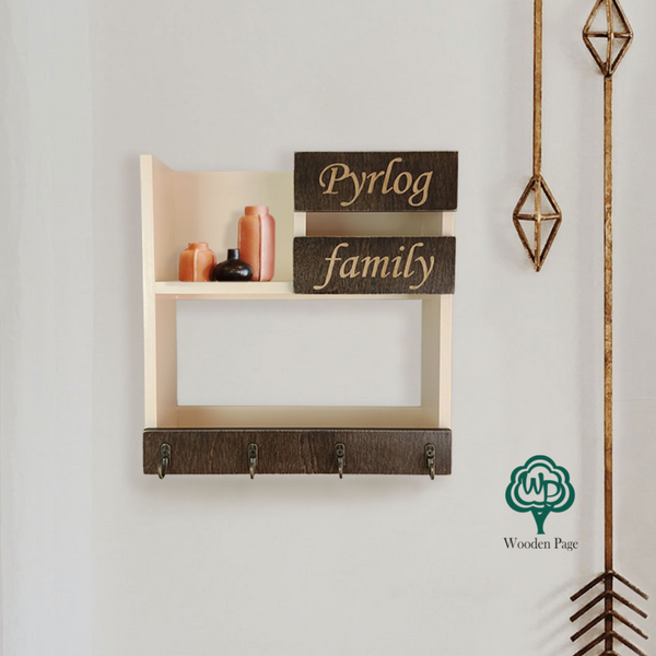 Shelf for keys with the family name in the hallway