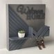 Key holder with a door on the wall