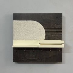 Key holder under the shield with faux fur