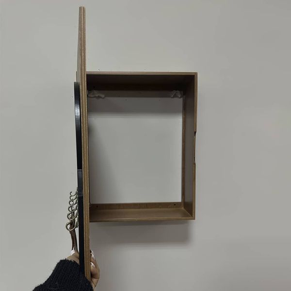 Key holder with a shelf on the shield