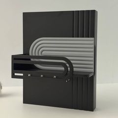 Designer key holder under the shield in dark colors