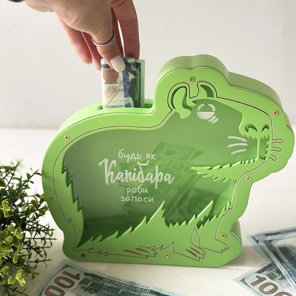 Piggy bank in the shape of a capybara in green color