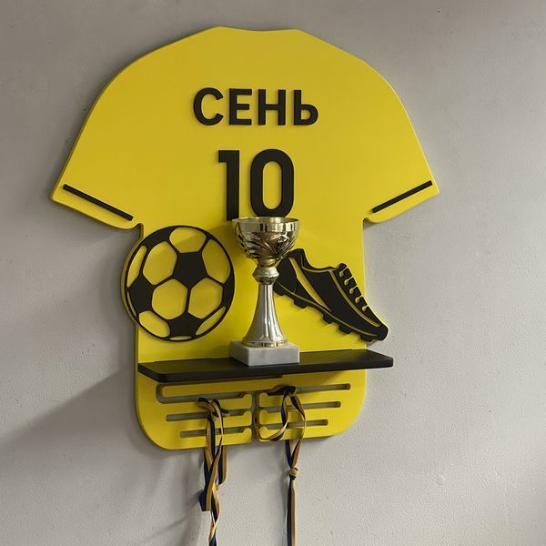 Shelf for football player awards with number and last name