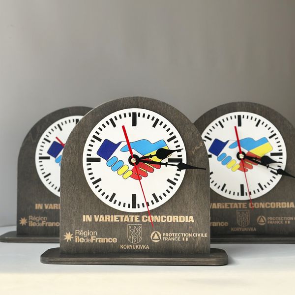 Wooden table clock with company logo