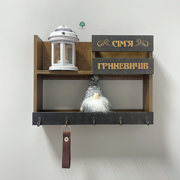 Shelf in the hallway with a surname in Scandinavian style