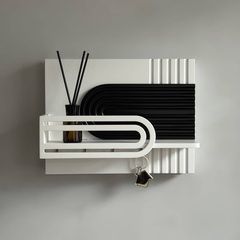 Designer key holder for a backsplash in black and white