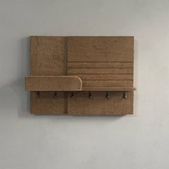 Oak-colored key holder on a shield