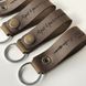 Leather keychain with the inscription "Dreams into reality"