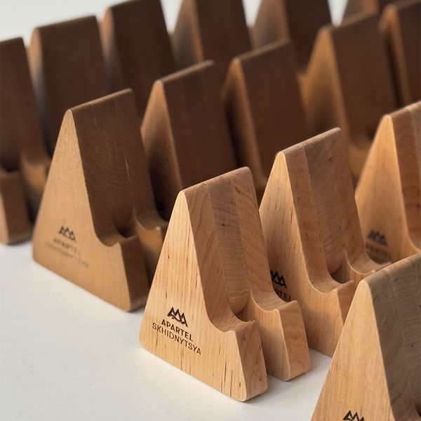 Wooden phone stand with company logo