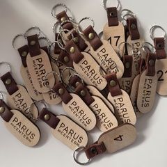 Leather-embedded keychains for business centers