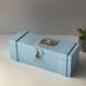 Wooden capsule with engraving in blue