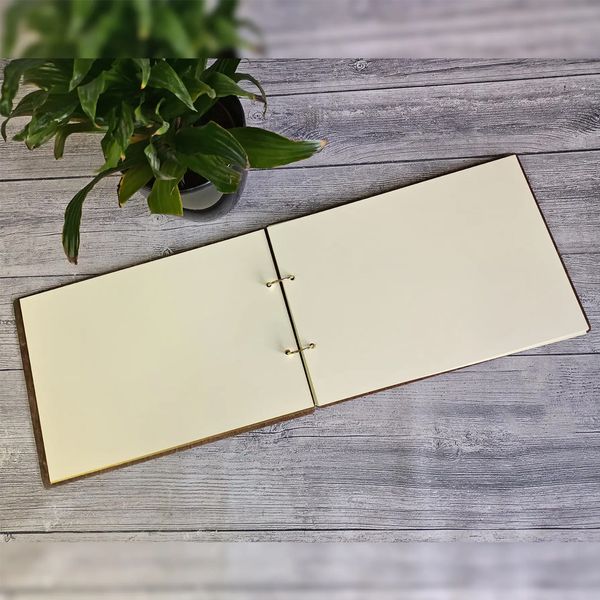 Wedding album in a wooden cover with custom engraving