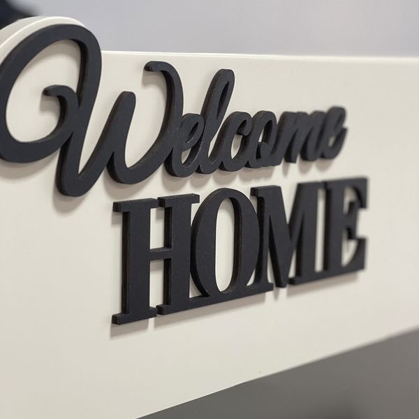 Designer key holder for the shield "Welcome Home" in beige and black