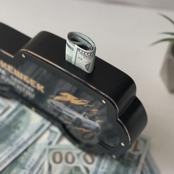Piggy bank in the shape of a tipping machine