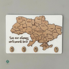 Key holder with a map of Ukraine and an inscription