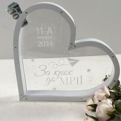 Piggy bank in the shape of a heart for graduation