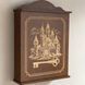 Wall mounted key holder with a door with a picture of a castle