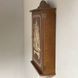 Wall mounted key holder with a door with a picture of a castle