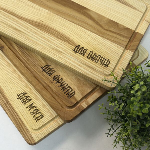 Set of kitchen boards with engraving for meat, vegetables and fruits