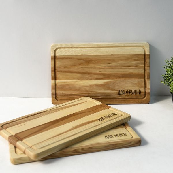 Set of kitchen boards with engraving for meat, vegetables and fruits